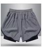 Shorts esportivos masculinos estilo americano fitness calças de corrida forro falso treinamento de duas peças anti-exposição quatro pontos basquete shorts casuais