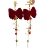 Brincos de meteoros rotativos Outono e inverno Ano Novo Brincos de laço vermelho Design de nicho doce Sense Ear Clip Mulheres