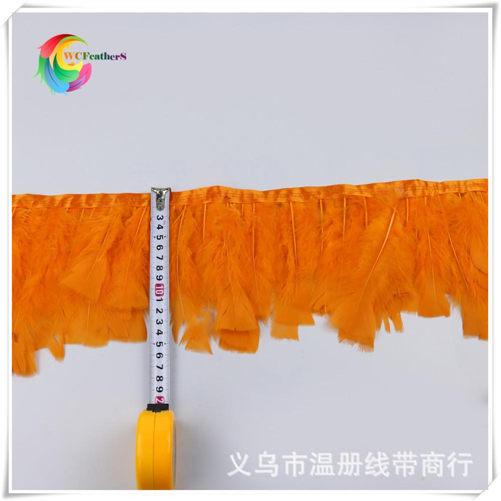 4 orange turkey feather trims