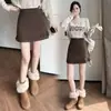 Falda corta de lana para mujer, colección otoño e invierno 2026, falda de lana línea A de cintura alta, shorts anti-exposición, bordes con volantes, minifalda súper elegante