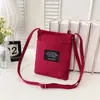 Bolso bandolera pequeño cuadrado de lona con bloques de color, moderno y versátil, para mujer, para teléfono móvil y monedas, portátil para el día a día, venta al por mayor