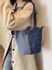 Bolso Cubo de Mezclilla Lavada de Nicho para Mujer 2026 Nueva Moda Bolso de Mano Versátil Estilo Commuter Bolso Cruzado