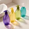 Nueva botella de prensa ovalada PET de colores, lisa y redondeada, para el envasado de champú, jabón de manos, loción corporal y productos de cuidado diario.