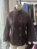 Ropa de mujer estilo europeo y americano 2026 nuevo modelo comercio transfronterizo al por mayor moda elegante abrigo de cuello alto de doble botonadura manga murciélago