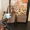 Bolso de mano simple de gran capacidad para mujer, nuevo modelo 2026, bolso tipo cubo texturizado de alta calidad, elegante bolso de hombro y cruzado