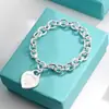 Pulsera para Pareja Etiqueta Inglesa en Forma de Corazón Marca T Cierre de Amor Ot Esmalte Azul Anillo de Corazón Melocotón Joyería Estilo Ins Transfronterizo