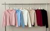Suéter de punto suave y ceroso de manga larga con encaje cosido en el cuello redondo, diseño nuevo de primavera, sensación dulce, delgado, camiseta base delgada para mujer