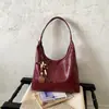 Bolso de Lona Retro de Gran Capacidad para Salir y Viajar 2026 Nuevo Elegante Casual Color Sólido Debajo del Brazo Diseño de Moda Bolso de Hombro