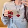Colar Essencial de Ano Novo Ankora com Laço Vermelho para Mulheres 2024 Novo Estilo Normcore Corrente de Suéter com Corda de Couro Preta Versátil