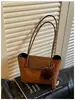 Bolso de axila de alta gama, estilo vintage, gran capacidad para mujer, nueva colección 2026, bolso tote elegante y versátil para el día a día.