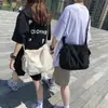 Bolsa de Lona Nueva Estilo Coreano Bolso de Hombro para Pareja Moda Tendencia Ropa de Trabajo Viaje al Aire Libre Bolso Cruzado Bolsa de Lona Venta al por Mayor
