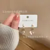 Pendientes de circonita con forma de estrella y perla de moda para mujer, diseño de nicho, pendientes de lujo ligeros de alta gama, elegantes pendientes de celebridades que combinan con todo.