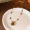 Collar Colgante de Calabaza con Piedra Ojo de Tigre Estilo Étnico Retro Cadena para Clavícula de Temperamento de Lujo Ligero Joyería Personalizada de Alta Gama Venta al por Mayor