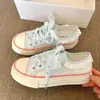 Zapatos planos de lona de caña baja 2026 nuevo estilo pastoral primavera-verano zapatos casuales florales zapatillas coreanas con ribete de encaje