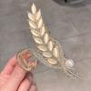 Pinza para el pelo de alta gama con piedra ojo de gato y espiga de trigo, pinza de tiburón para mujer, pinza de hoja de lujo ligero, pinza de hoja vintage elegante