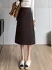 Saia Média Feminina 2025 Outono e Inverno Novo Estilo Bainha Assimétrica Estilo Ocidental Saia Evasê Cintura Alta Moda Solta Saia Tubinho