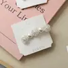 Pinza para el pelo de perla de lujo ligero de Corea del Sur Pinza de pico de pato Fresca y dulce Pinza lateral Pinza de un carácter Pinza para el pelo Tocado