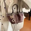 Bolso tipo cubo informal de gran capacidad 2026, bolso versátil para mujer, nuevo y elegante bolso de hombro de ante para el día a día, simple y retro