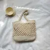 Bolsa de praia portátil de grande capacidade para mulheres, nova bolsa de trama oca da primavera de 2026, bolsa versátil casual de ombro e axila
