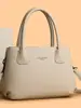 Bolso de mano vintage de cuero suave transfronterizo para mujer, nuevo modelo 2026, bolso de hombro y cruzado de moda de alta gama de gran capacidad