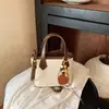 Moda transfronteriza simple y elegante estilo coreano diseño de nicho bolso de hombro cruzado casual, bolso de mano de color sólido moderno tipo cubo