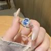 Anillo abierto de topacio azul de imitación con diseño de huevo de paloma retro francés, anillo ajustable de circonita de alta calidad para mujer