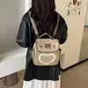 Mochila Bordado Academia Bolsa de Ombro Duplo Feminina Novo Estilo Ursinho Estilo Estampa de Leopardo Nicho Desenho Animado Temperamento Commuting Moda 2026