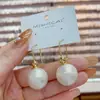 Elegantes y a la moda aretes colgantes de perla estilo coreano, con un diseño único y estiloso, perfectos para el uso diario y para complementar cualquier atuendo.