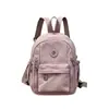 Bolsa multifuncional impermeable de nylon para mujer con múltiples compartimentos, mochila versátil estilo japonés para comercio exterior transfronterizo que también se puede usar como bolsa de pecho