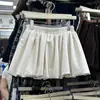 Saia Curta Nova Estilo Primavera e Outono 2026 Floral Antiexposição Linha A para Mulheres Baixas, Cintura Alta Emagrecedora Meia Saia