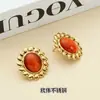 Moda europea y americana nicho pendientes vintage acero de titanio chapado en oro de 18 quilates temperamento geométrico piedra natural ojo de gato solar pendientes mujer