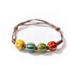 Flor de horno creativa esmalte cuentas de cerámica tejidas estilo étnico IV mirando hacia atrás pulsera con cuentas pulsera joyería al por mayor