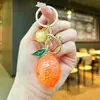 Accesorios creativos transfronterizos de mango y limón, llaveros de coche modernos y populares, colgantes de bolsa de frutas de alto valor