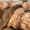 Juego de ropa de cama de cuatro piezas de terciopelo de leche de invierno con diseño de pompón, que incluye una funda de edredón gruesa de forro polar de coral bordada y una sábana bajera.