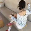 Atualização do tamanho enviado estilo chic coreano novo design francês senso de design costas vazadas amarração listrado malha suéter roupas femininas