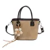 Bolso de Mano de Nicho de Moda para Mujer 2026 Nuevo Elegante Versátil Bolso Cruzado Simple Colgante de Flor Bolso Cubo de Piel PU
