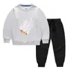 Ropa infantil transfronteriza nueva Otoño e Invierno 2023 suéter para niños pantalones traje de dos piezas color liso bebé algodón manga larga