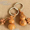 Entrega directa de fábrica de llaveros de calabaza del zodíaco de madera de durazno, llaveros del zodíaco de los doce animales para coche, llaveros de madera de durazno y llaveros de calabaza