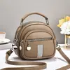 Bolso de mujer 2026 nuevo modelo multibolsillos con cremallera, bolso de mano redondo pequeño, simple y versátil para ir al trabajo, bolso de hombro y cruzado