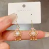 Nuevos pendientes de gancho con perla auspiciosa estilo chino, sensación de temperamento fresco, pendientes de celebridad de internet, nuevos pendientes de moda 2025