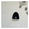 Versión coreana de gorro de lana tejido con logo de cara sonriente de personalidad de otoño e invierno para niños, gorro pullover cálido para niños y niñas, venta al por mayor