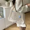 Bolso Grande de Mujer 2026 Nuevo Estilo de Nicho Hombro Único Vacaciones en la Playa Tejido de Paja Bolso Tote para el Trabajo