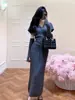 Elegante e estiloso conjunto de tricô 2026 outono e inverno novo suéter de manga curta slim-fit + polainas para braços + saia curta conjunto de três peças para mulheres
