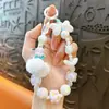 Llavero de cadena para teléfono con pompones y cuentas transfronterizo, colgante lindo para bolso, llavero de coche, regalo pequeño, venta al por mayor de comercio exterior