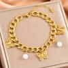 Moda transfronteriza pulsera de perlas colgantes de mariposa hueca tridimensional Joker acero inoxidable cadena cubana pulsera en stock al por mayor mujeres