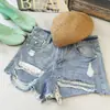 [En Stock] Nuevos Shorts de Mezclilla Rasgados Estilo Ahixia para Mujer, Shorts Delgados Adelgazantes de Corte A con Bordes Deshilachados