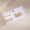 Brincos de Tarraxa de Aço Inoxidável Europeus e Americanos Mais Vendidos Cruzados para Mulheres Estrela de Diamante Incrustada em Ouro Argolas de Orelha Anéis Redondos Geométricos Vermelhos Acessórios de Brinco da Moda