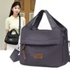 Bolsa de ombro feminina 2026 primavera e outono novo tecido de nylon bolsa de mão urbana simples casual bolsa de mãe bolsa transversal
