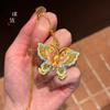 Colgante de mariposa con flor de pulso dorado de arena de tienda de oro, bricolaje con collar, dulce temperamento de moda, regalo para novia que combina con todo