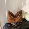 Bolsa de Design de Moda Transfronteiriça Nicho com Tachas para Axila para Mulheres 2026 Nova Bolsa de Mão para Outono e Inverno Bolsa de Ombro Bolsa Saco Biker